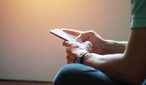 Close up of man using smart phone