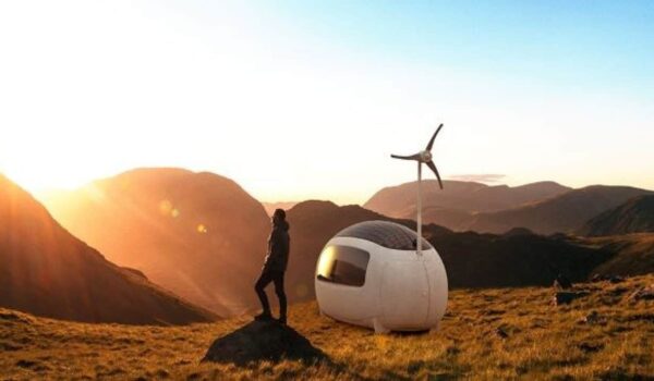 A man stands near the eco-capsule